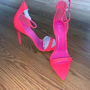 Bright neon pink high heeled shoes